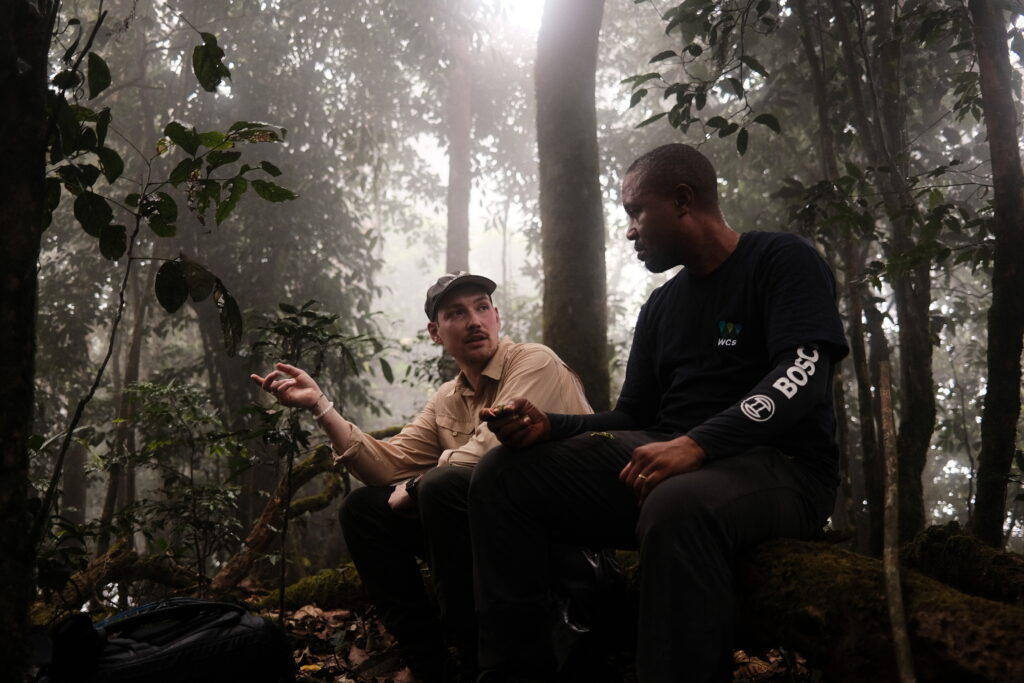 Tom chatting to Emmanuel Bassey in the forest