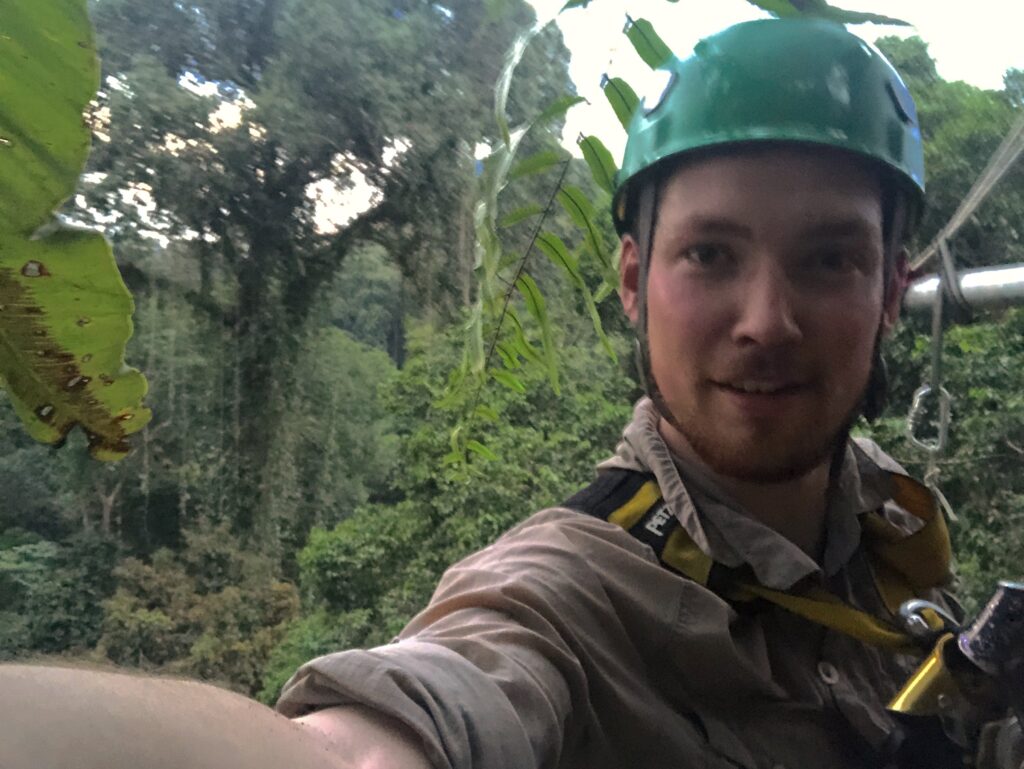 Tom Richards filming in the rainforest canopy