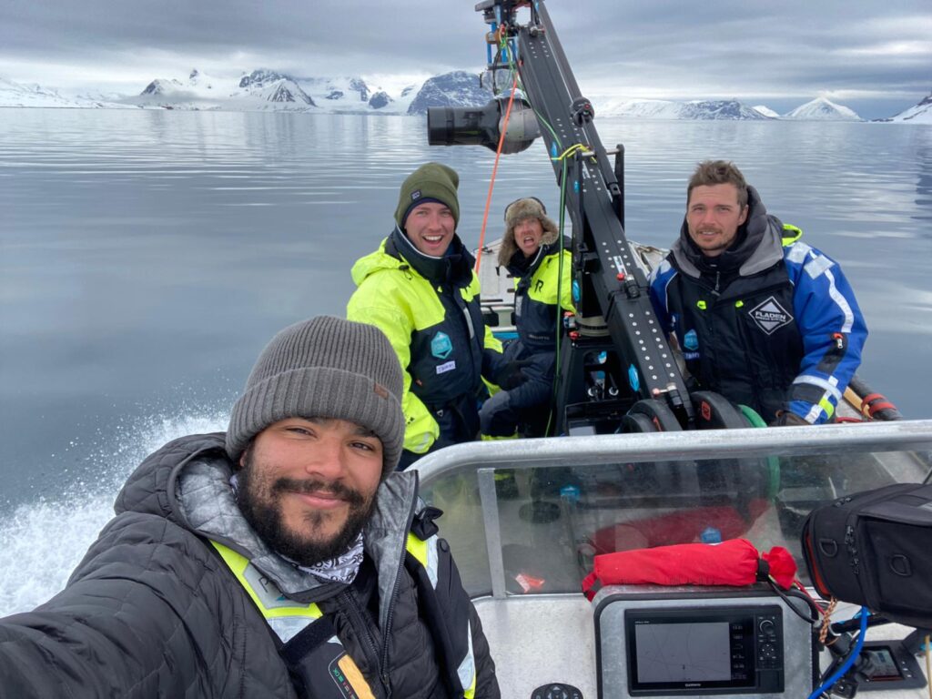 The Earthsounds crew filming from a boat in Svalbard