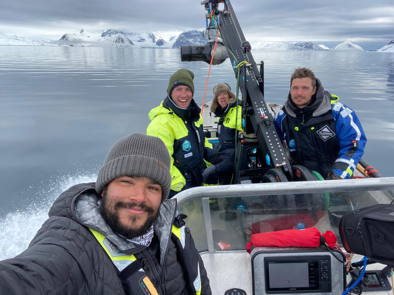 The Earthsounds crew filming from a boat in Svalbard